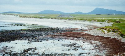 the landing field of Benbecula Airport, backing with South & North Lee of North Uist