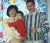 Family in Sara's room by Winnie the Pooh curtain. 1999/12. (10.jpg 54k)